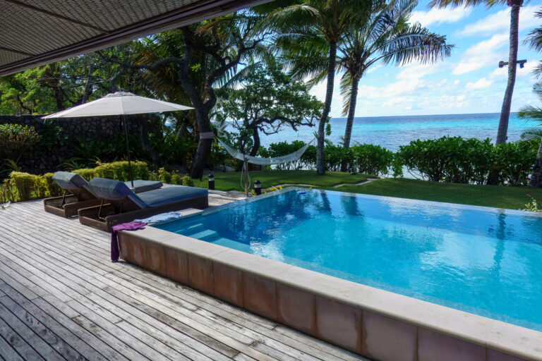 A villa infinity pool at Kokomo Private Island, looking out over the water