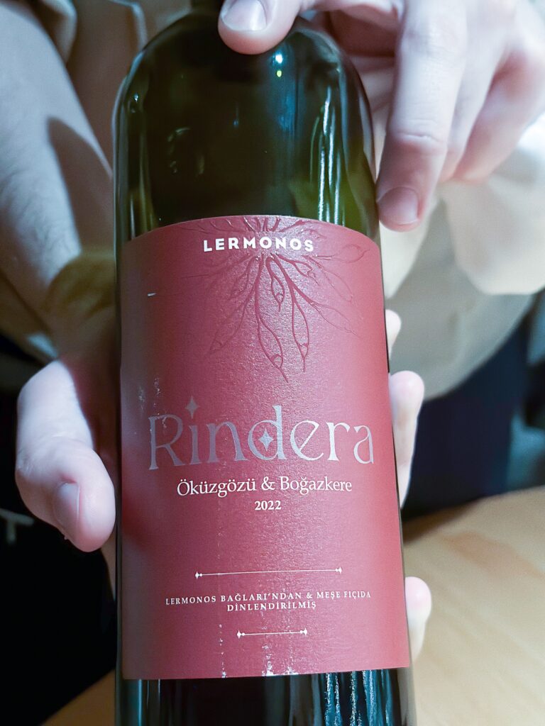 The label of Lermonos Rindera 2022 held close, Okuzgozu and Bogazkere lettered in white on deep red