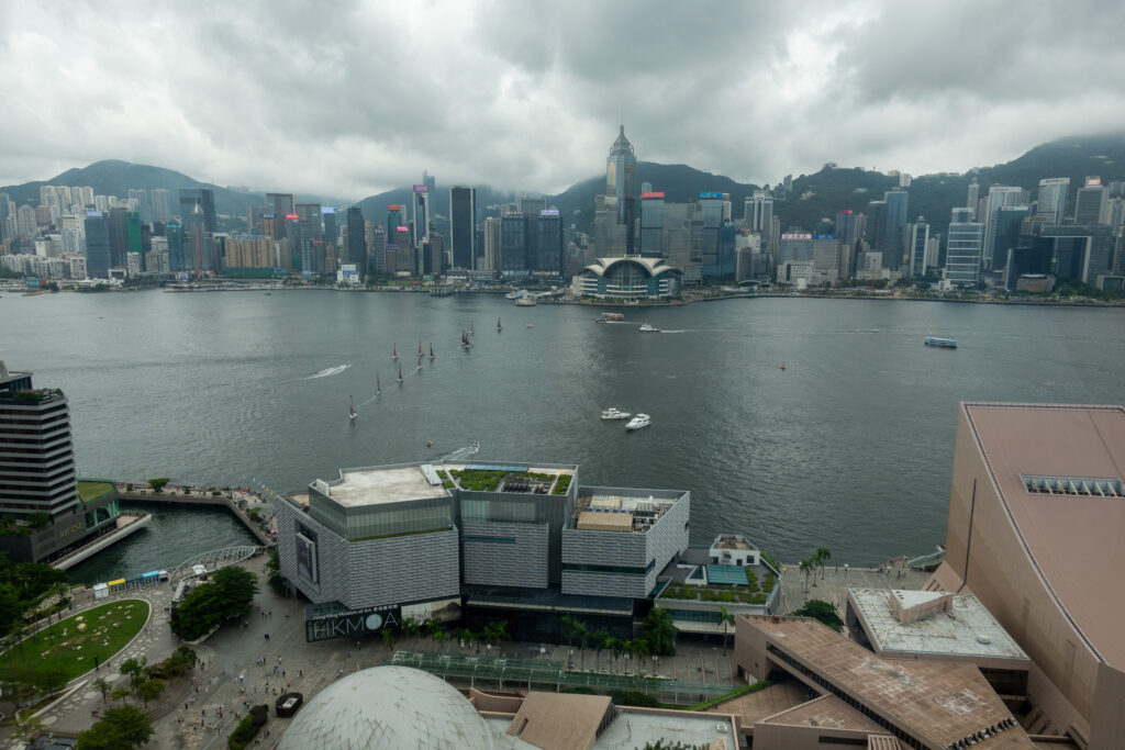 Victoria Harbour on an overcast day, the Convention Centre and Hong Kong Island under low cloud