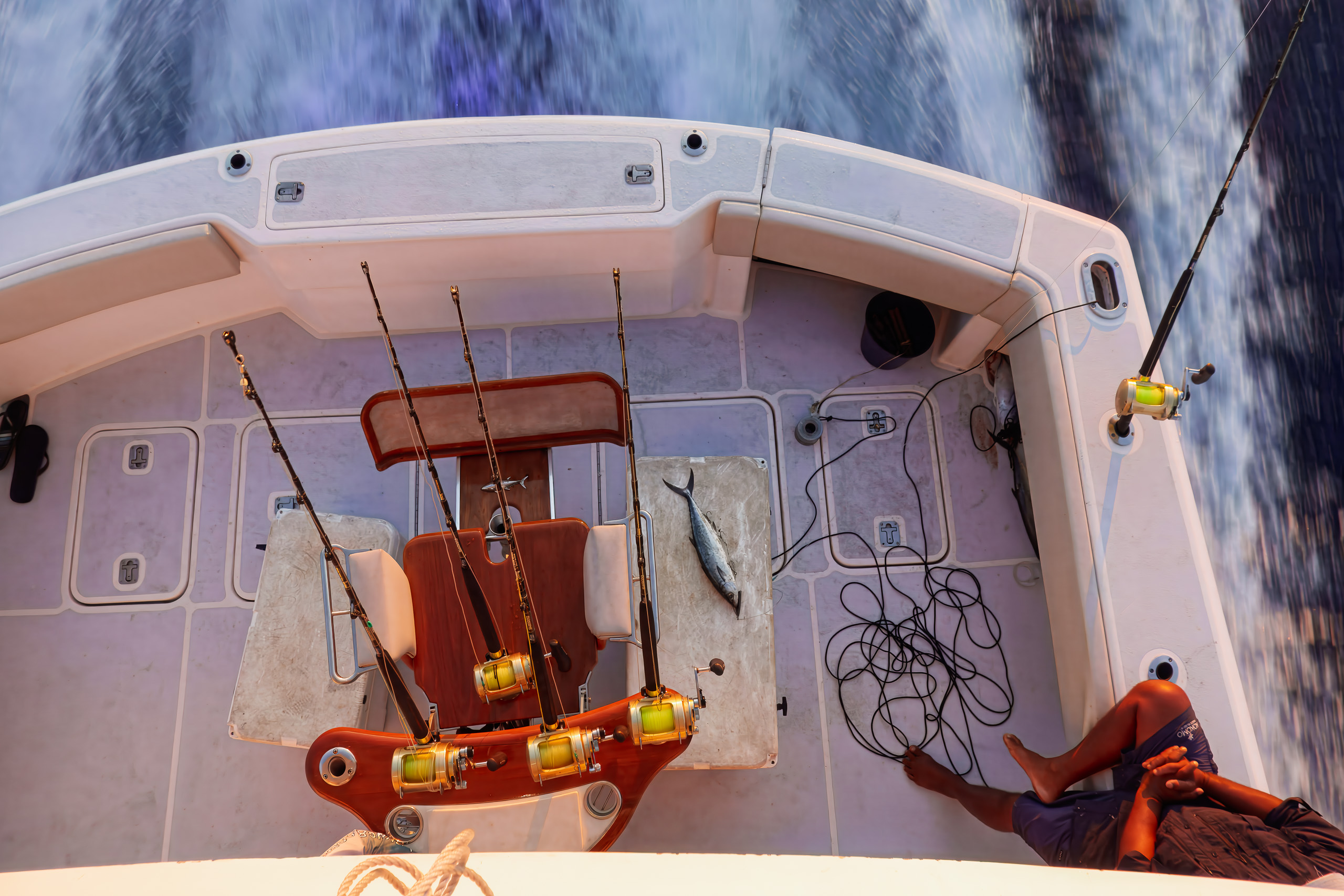 Trolling rods, reels and the fighting chair set up on the back deck