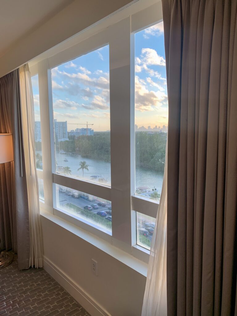 Late afternoon light through a guest room picture window looking west over Indian Creek