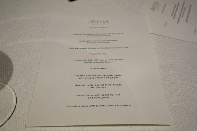 The tasting menu on the table, ten courses running from red pepper flat bread to chocolate cake with pickled plum ice cream