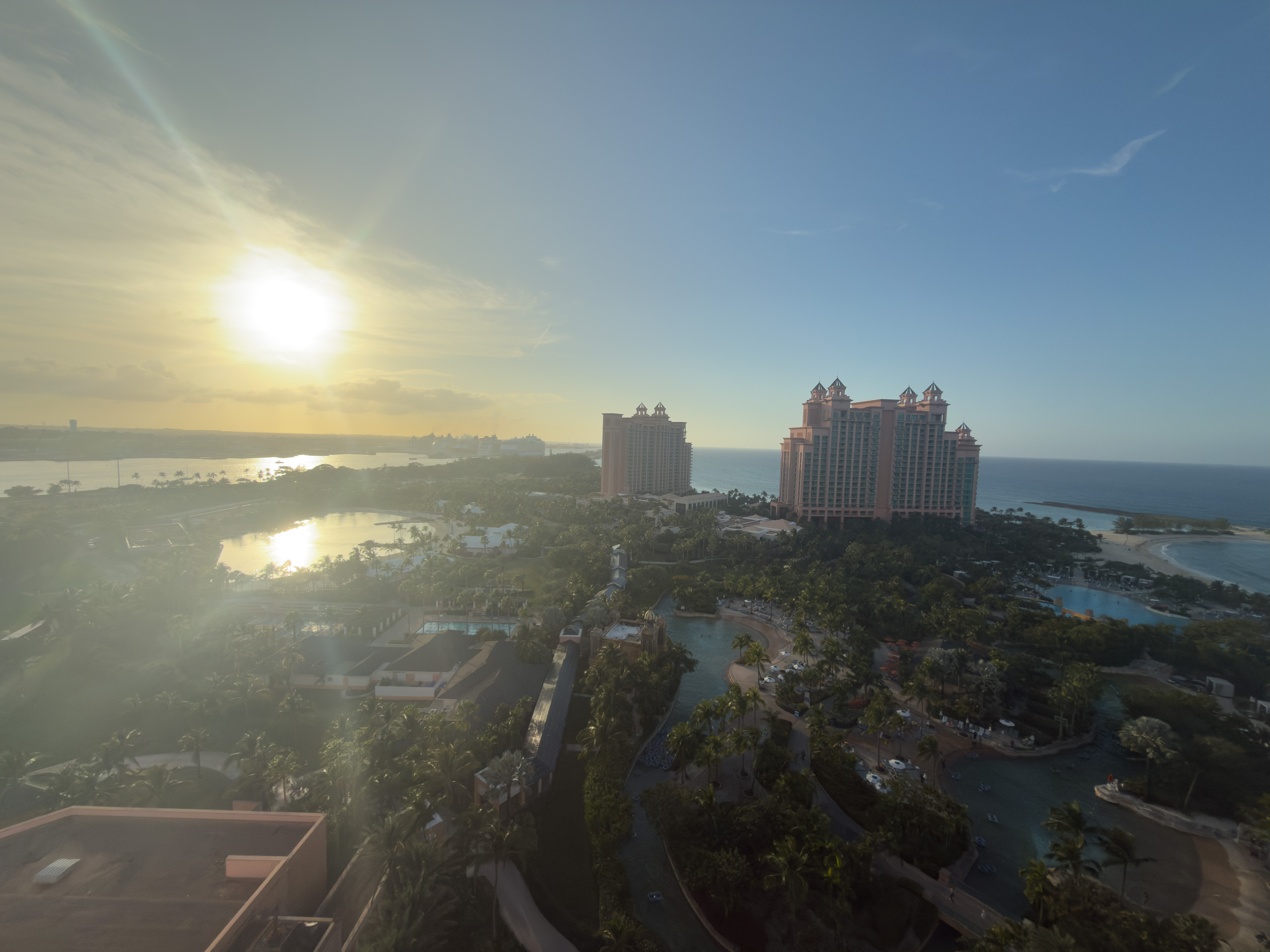 Morning haze over the Royal Towers from a high floor, the grounds still in shadow