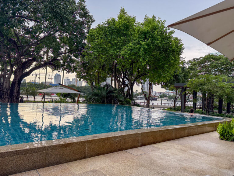 The long pool running to the water, old trees standing over the far end