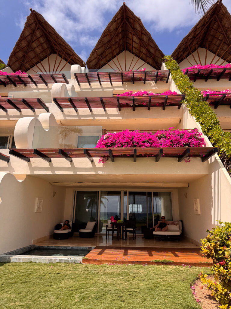 The villa front under bougainvillea
