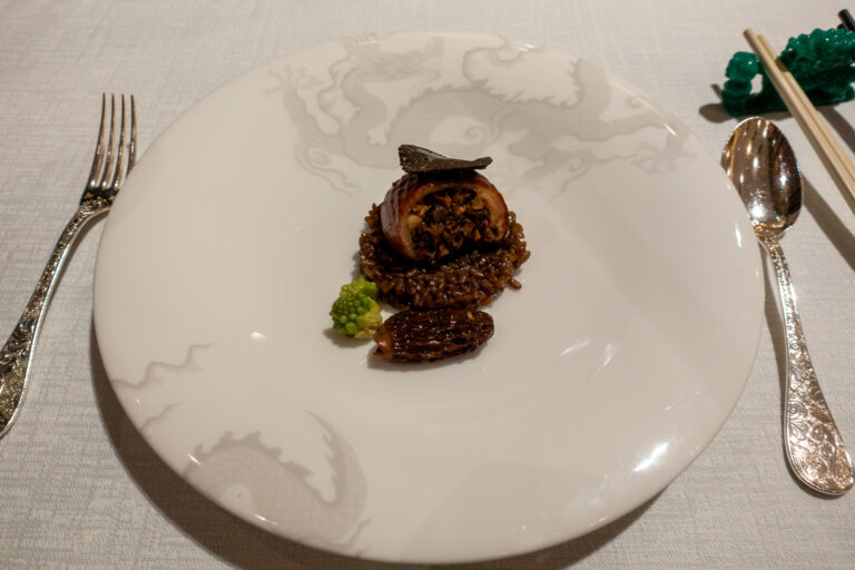 A braised course on a plain white plate