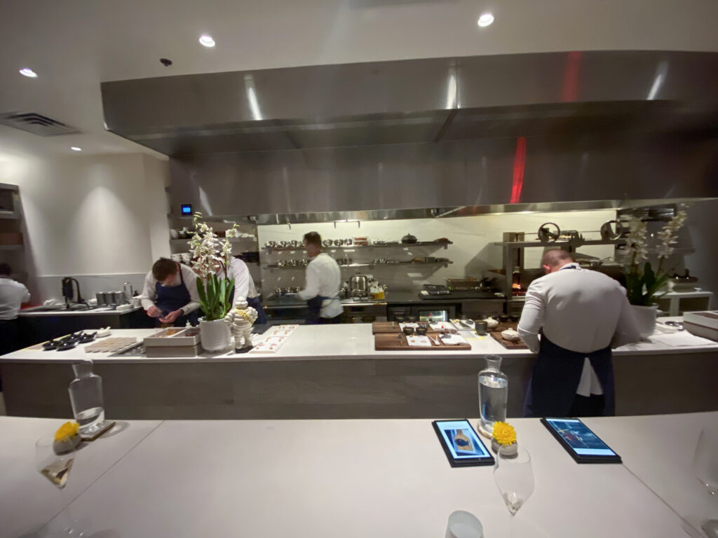 The kitchen brigade at work behind the pass at Jônt