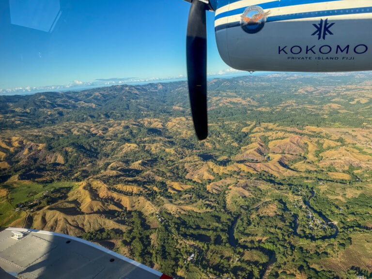 Wing over the green hills on the flight out