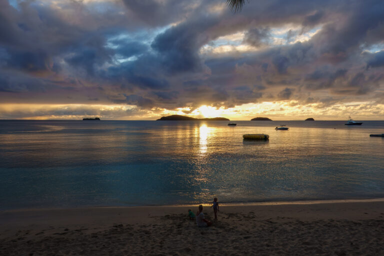 Sunset over the water from the beach