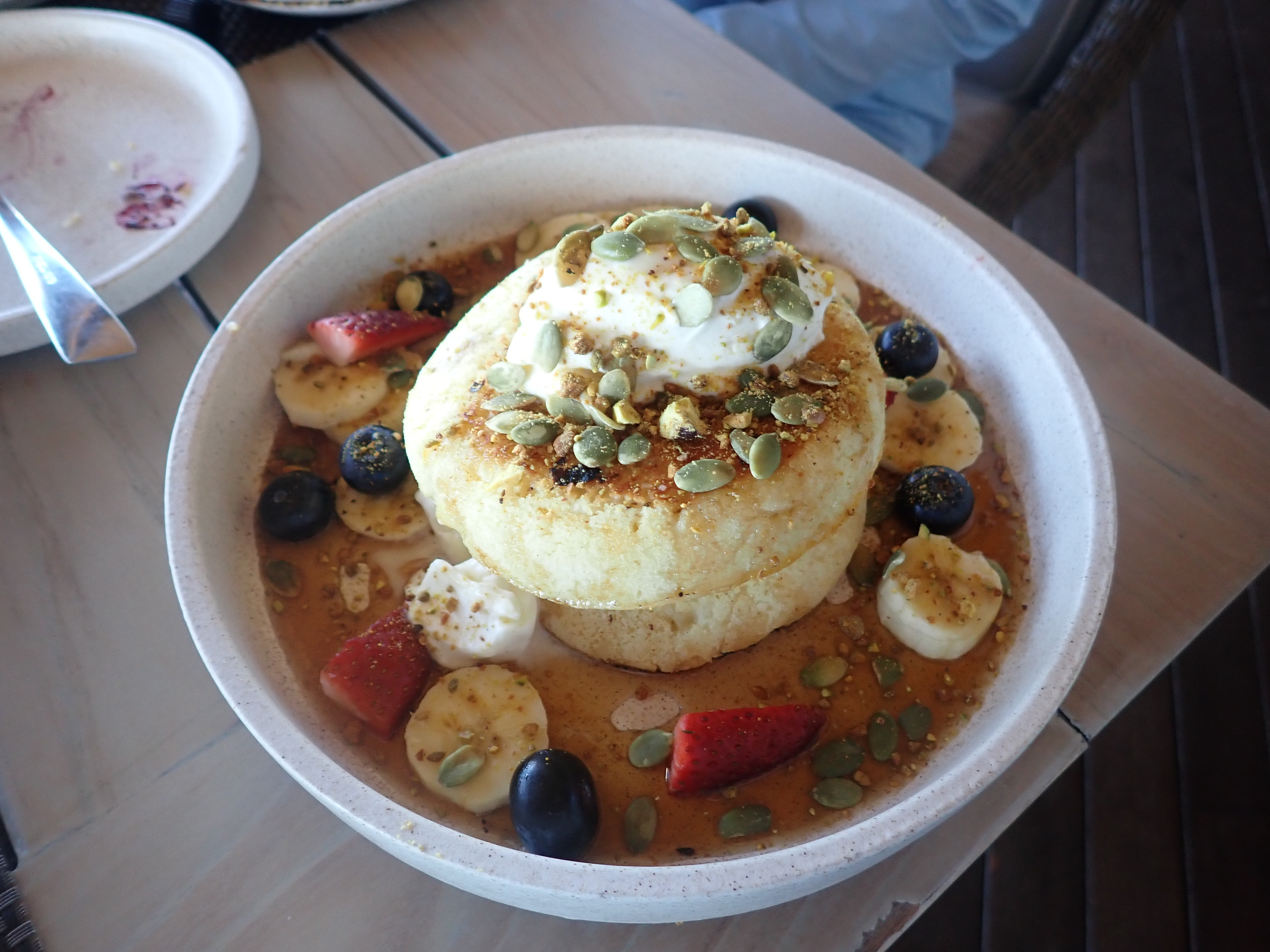 Fruit and coconut in a bowl at breakfast