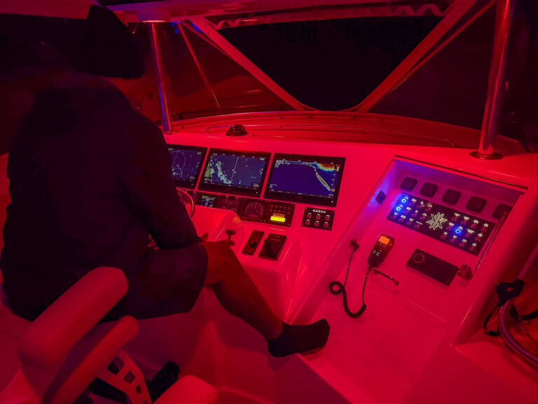 The helm under red light on the run home