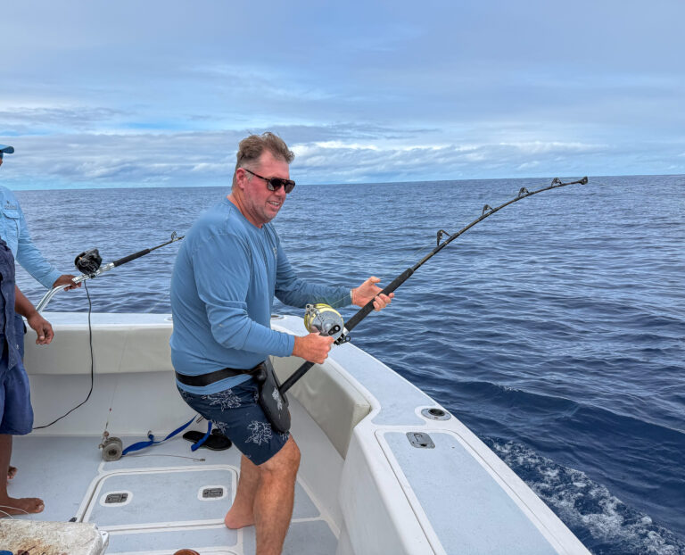 Standing to the rod with the mate on the line