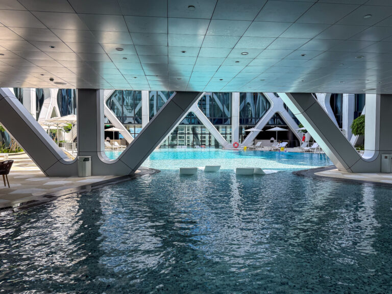 The pool set beneath the building&rsquo;s exoskeleton