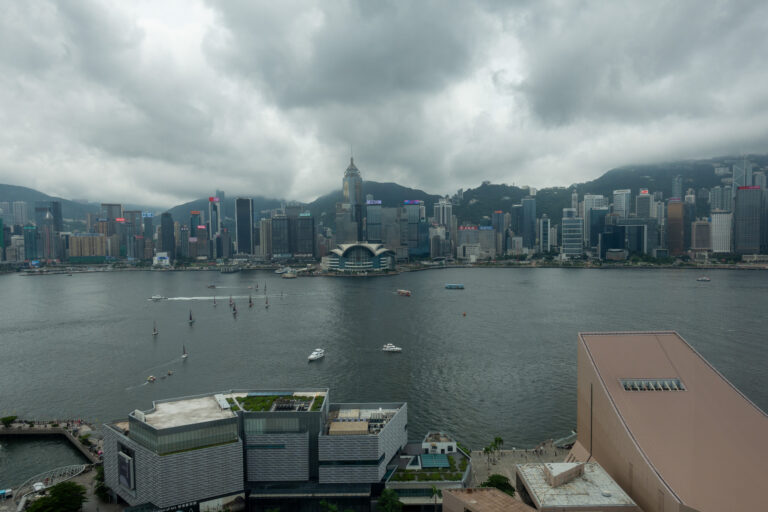 Heavy cloud over the harbour and the island seen from high up