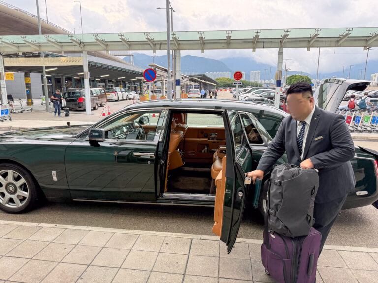 The hotel’s green Rolls-Royce waiting at the door