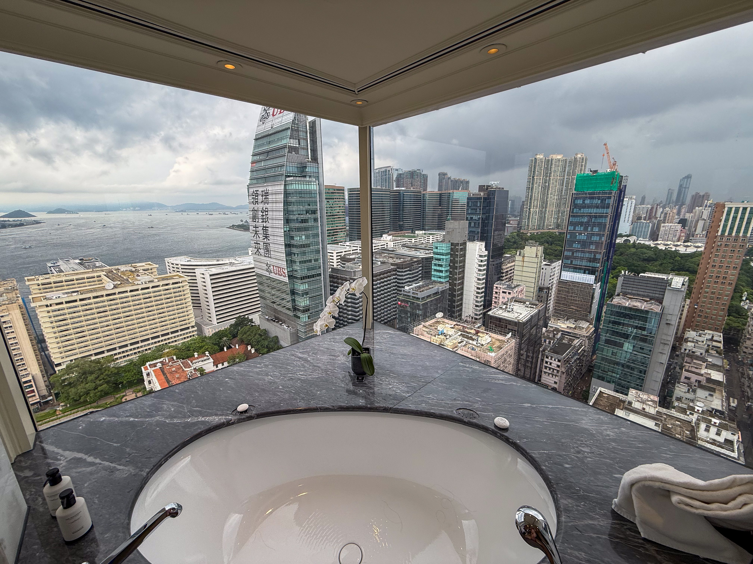 The tub in the window with the towers and the water beyond