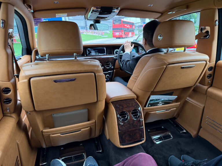 The cabin of the hotel Rolls-Royce, the driver at the wheel