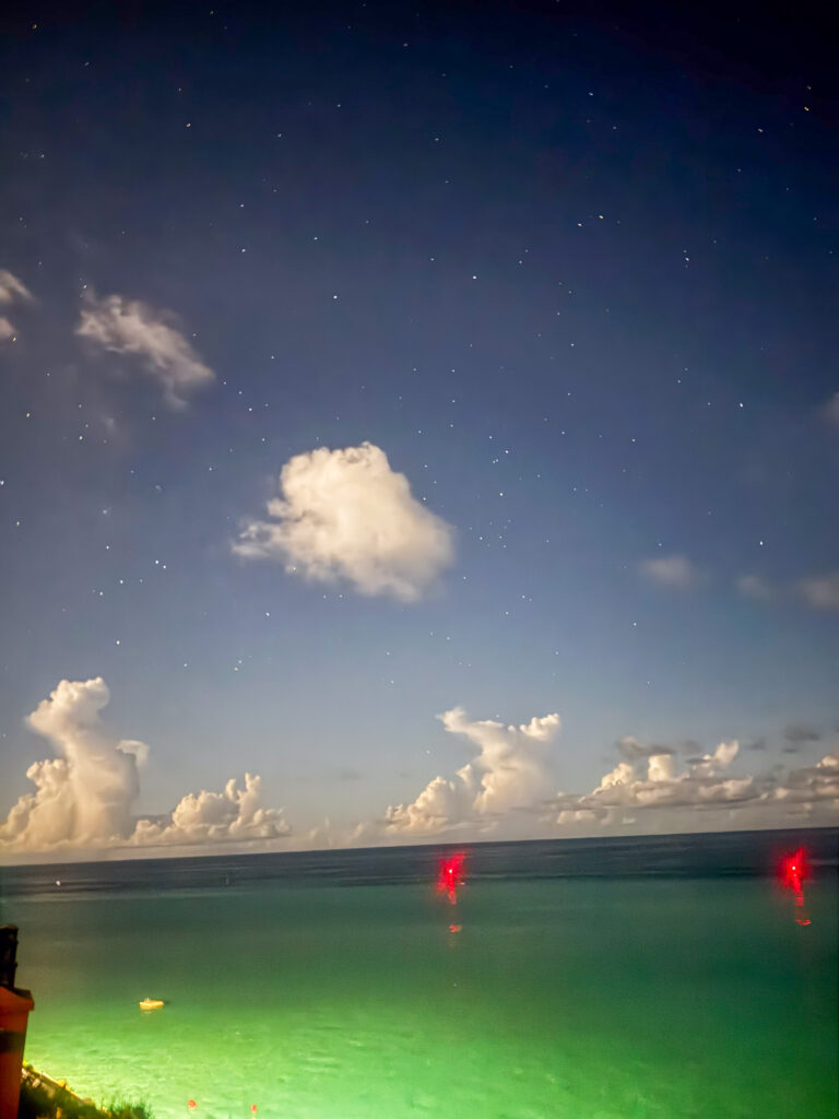 A long exposure over the water as the last green holds on the horizon