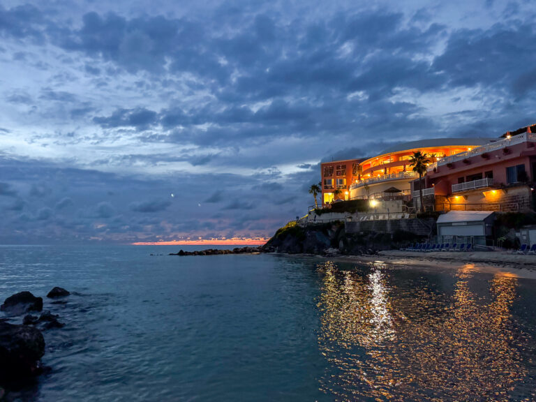 The property lit up along the bluff after dark