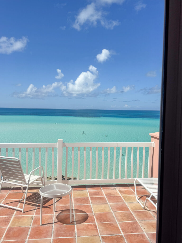 Two chairs on the terrace facing the water