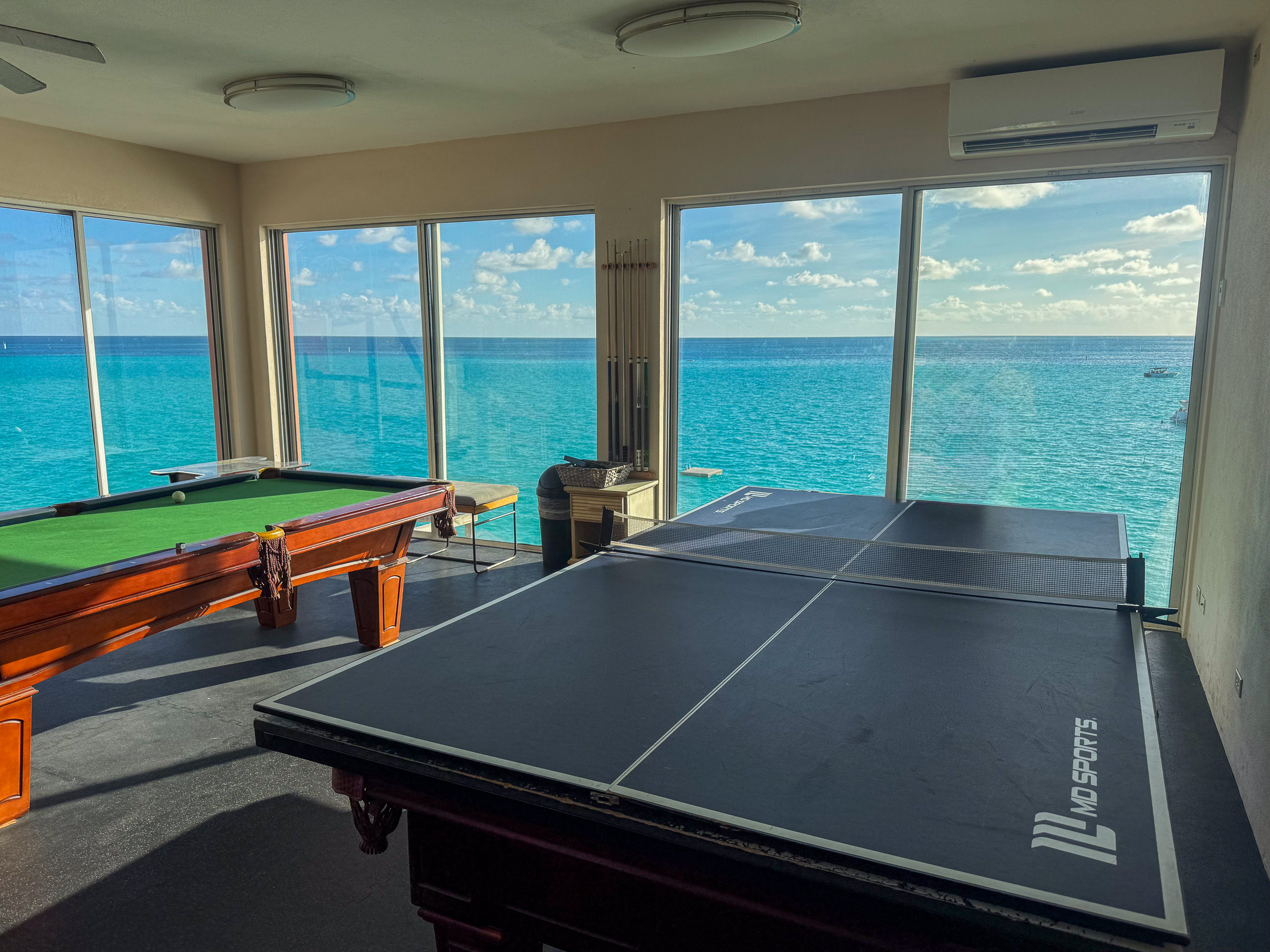 The games room, the table set up in front of the windows