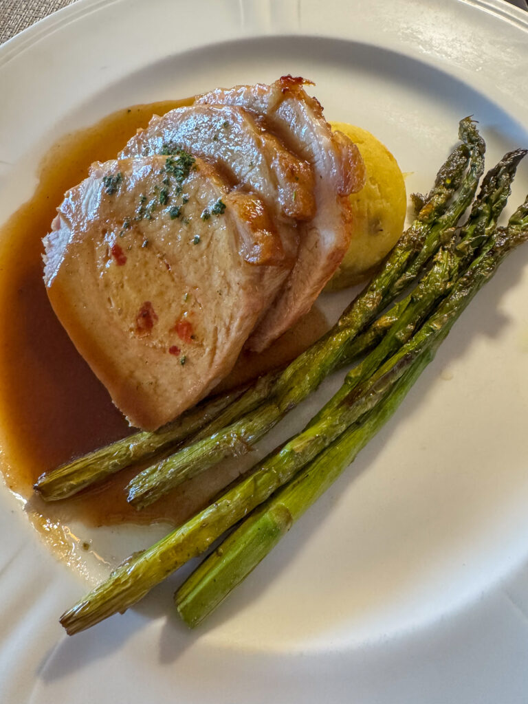 Scallops with asparagus in a clear broth