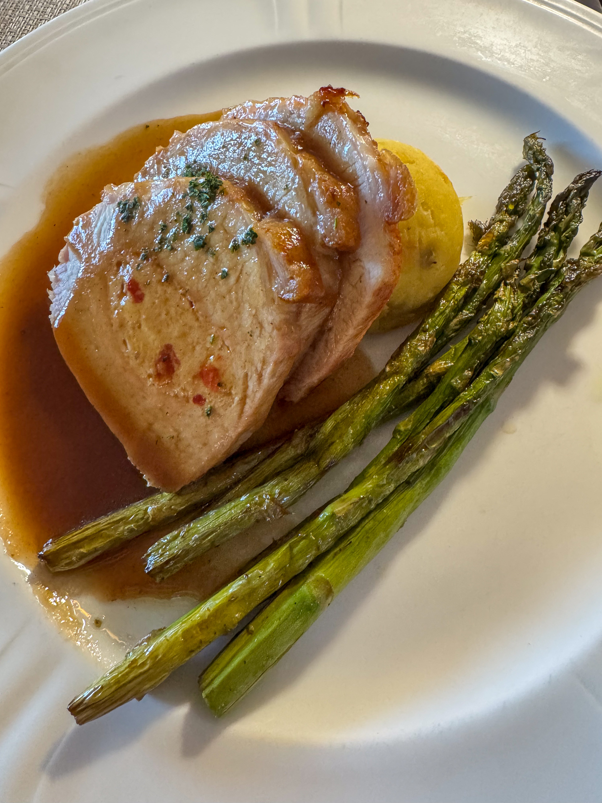 Scallops with asparagus in a clear broth