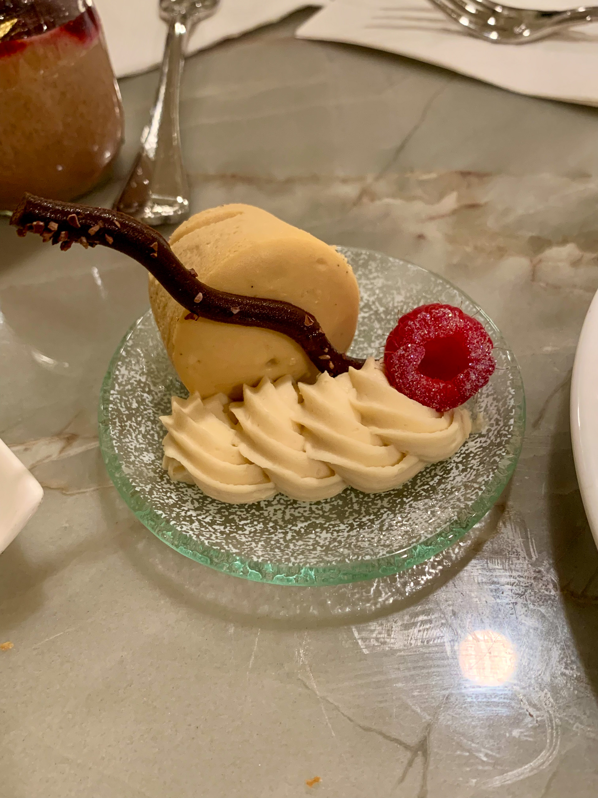 Sliced banana and chocolate on a glass stand