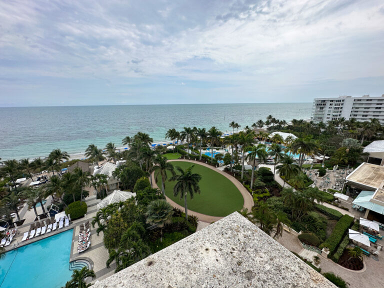 The pool, the lawns and the sea from the balcony, late in the afternoon