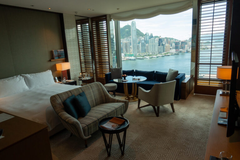 The living area in daylight with the shutters open to the harbour