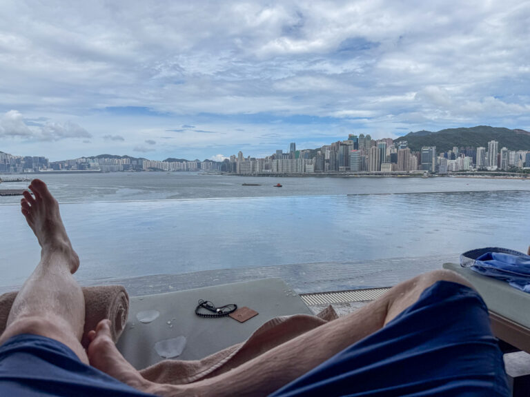 Feet up on the daybed with the water and the far shore beyond