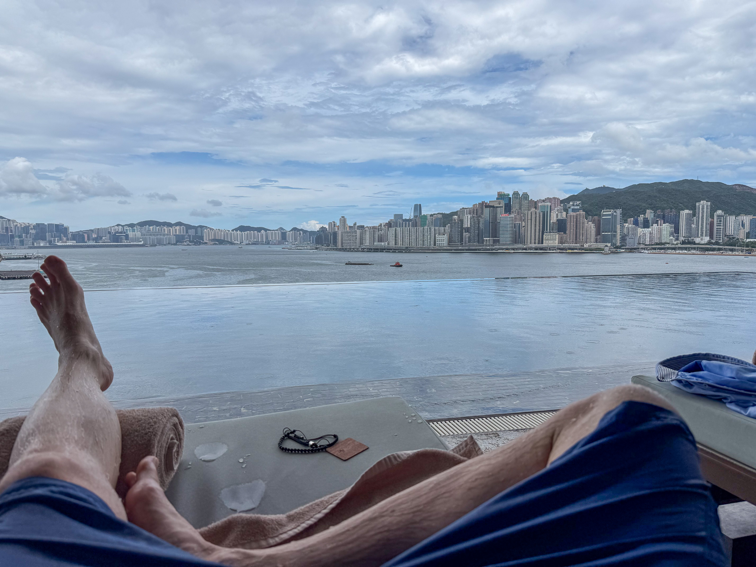 Feet up on the daybed with the water and the far shore beyond