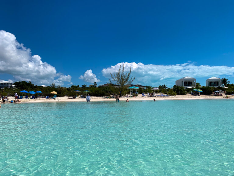 The beach and its umbrellas seen from out in the water