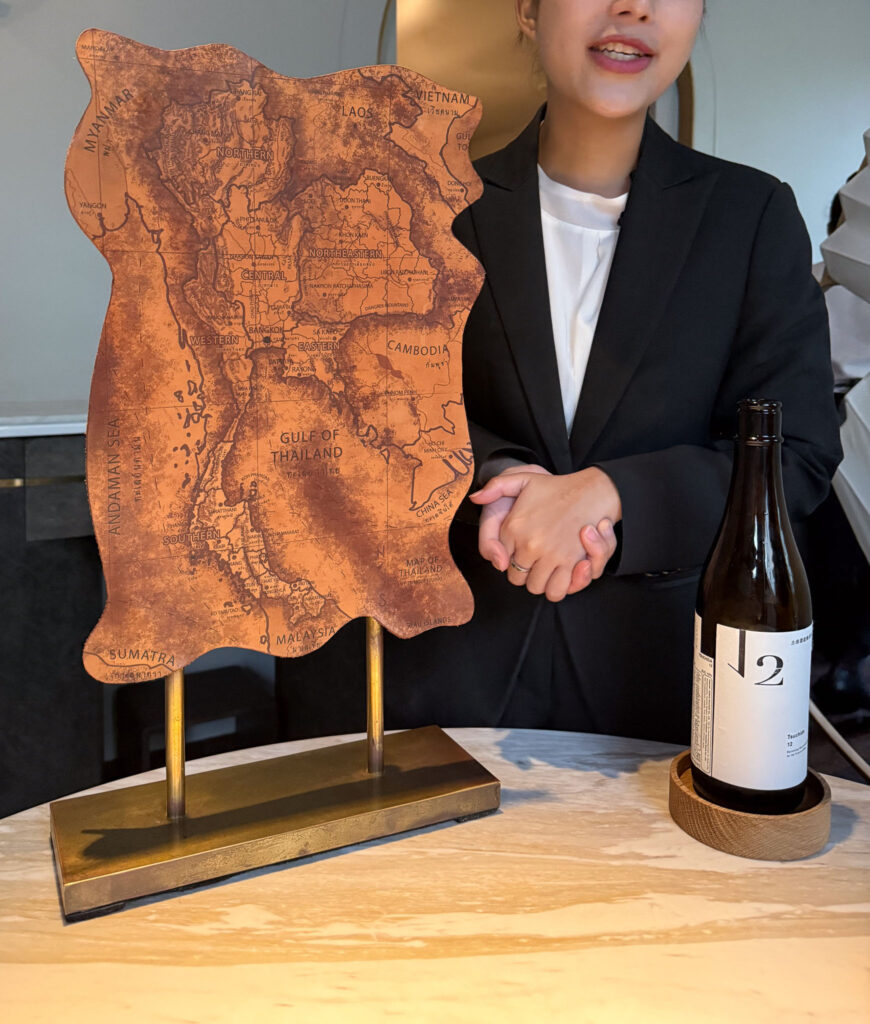 A member of the team presenting an ingredient at the table