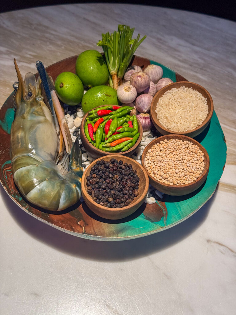 Fresh chillies, aromatics and dry spices set out on a tray