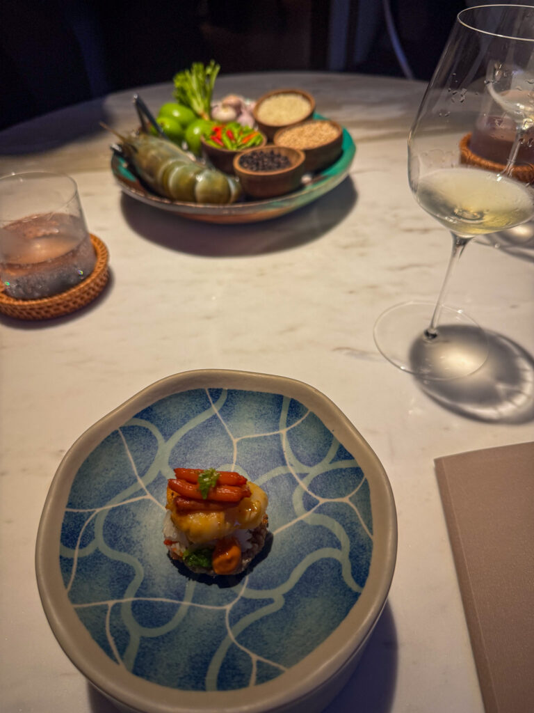 The first dishes set down on the marble
