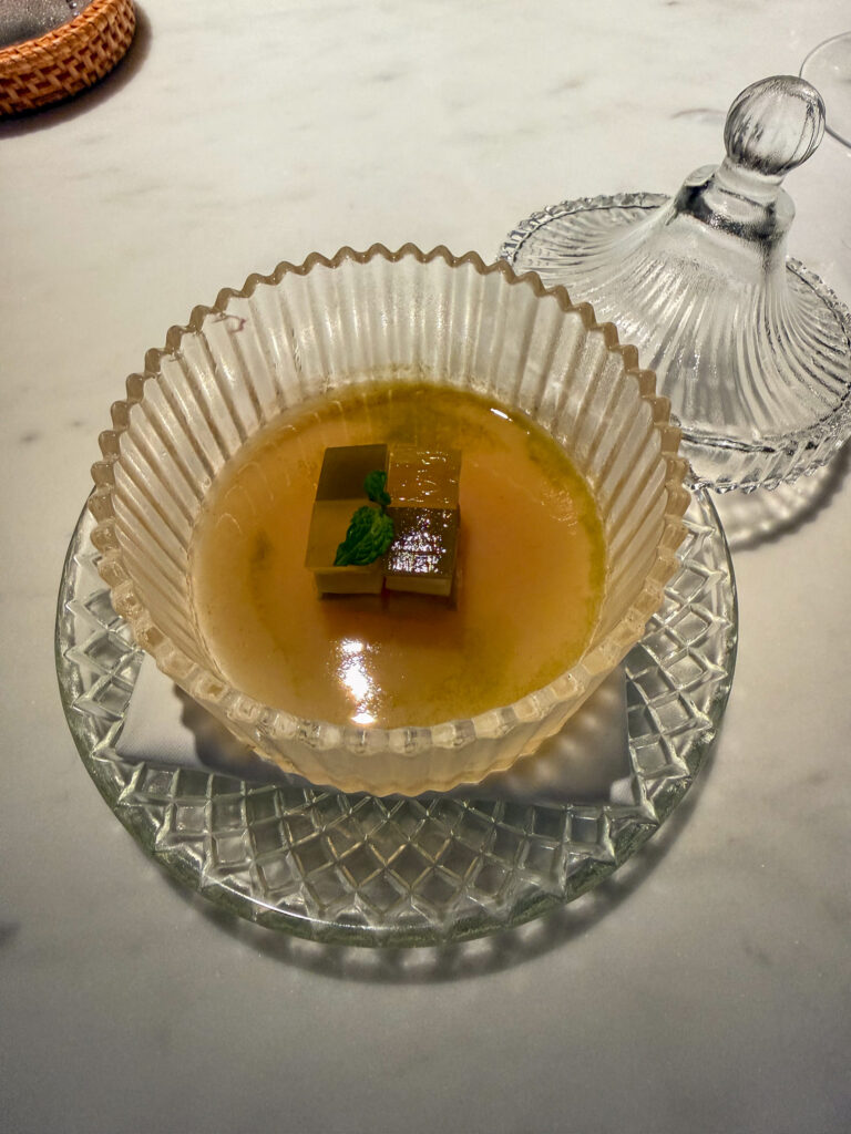 A clear cup of jellied broth