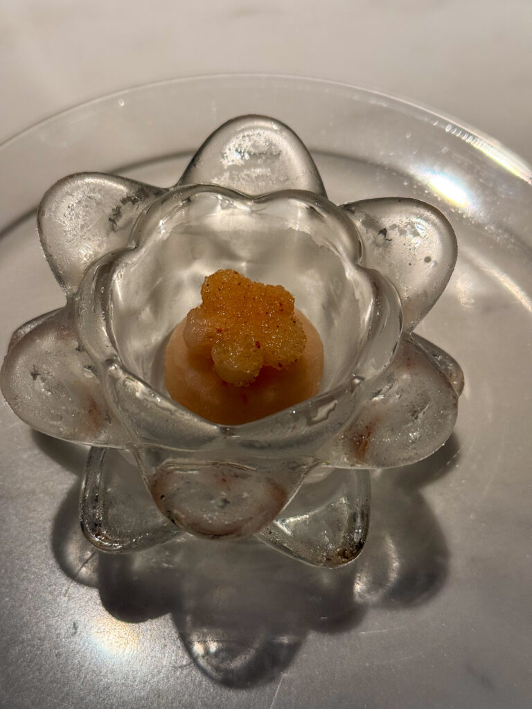 A small course served in a flower-shaped cut-glass dish