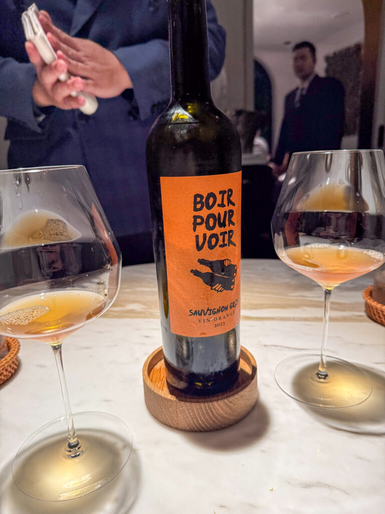 An orange wine opened at the table