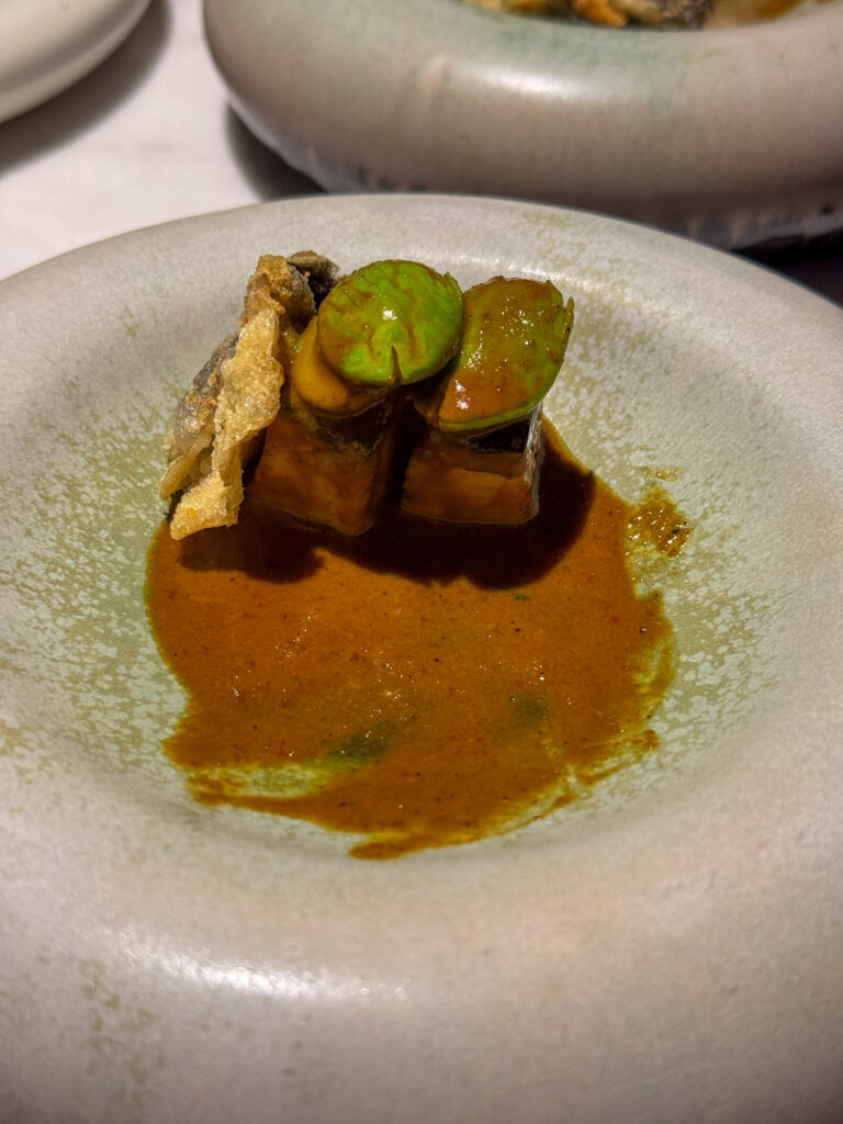 A course finished in a green sauce