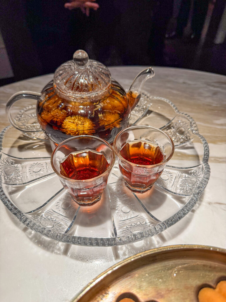 The sweets under a glass dome on the tiered stand