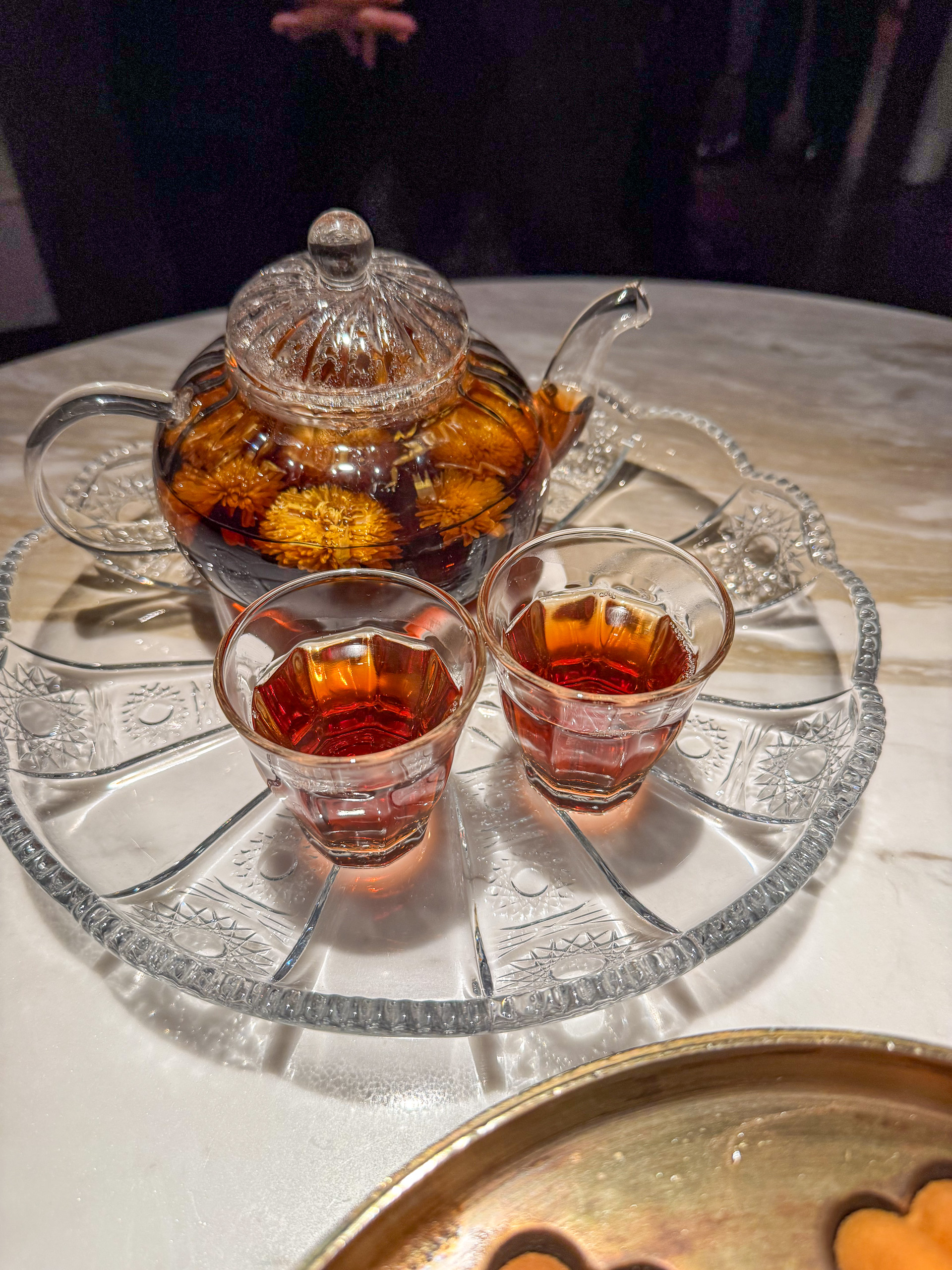 The sweets under a glass dome on the tiered stand