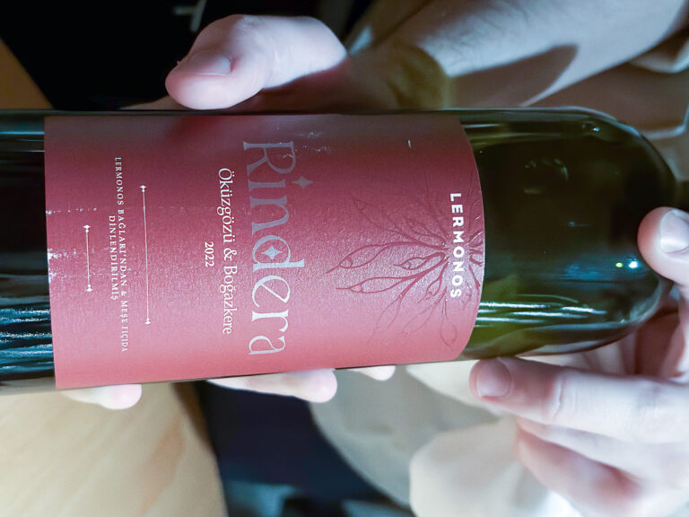The Rindera label held close, its pink script filling the frame