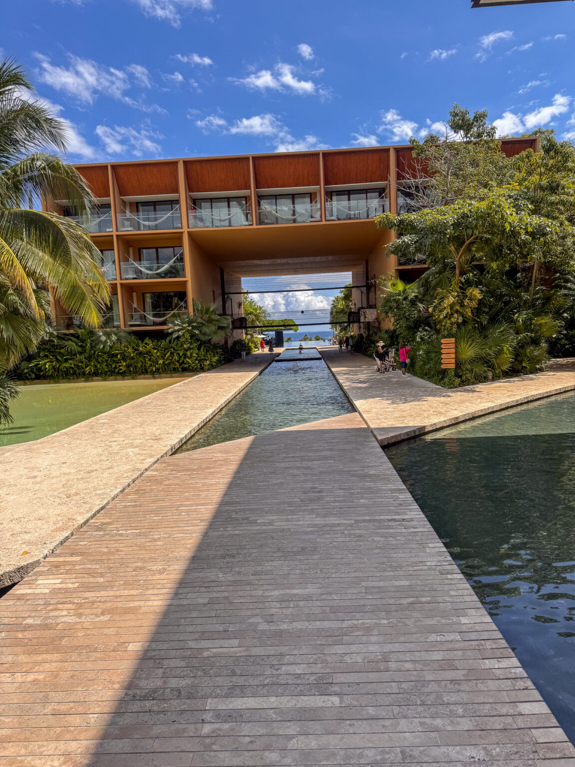 A walkway running the length of the reflecting pool to the building