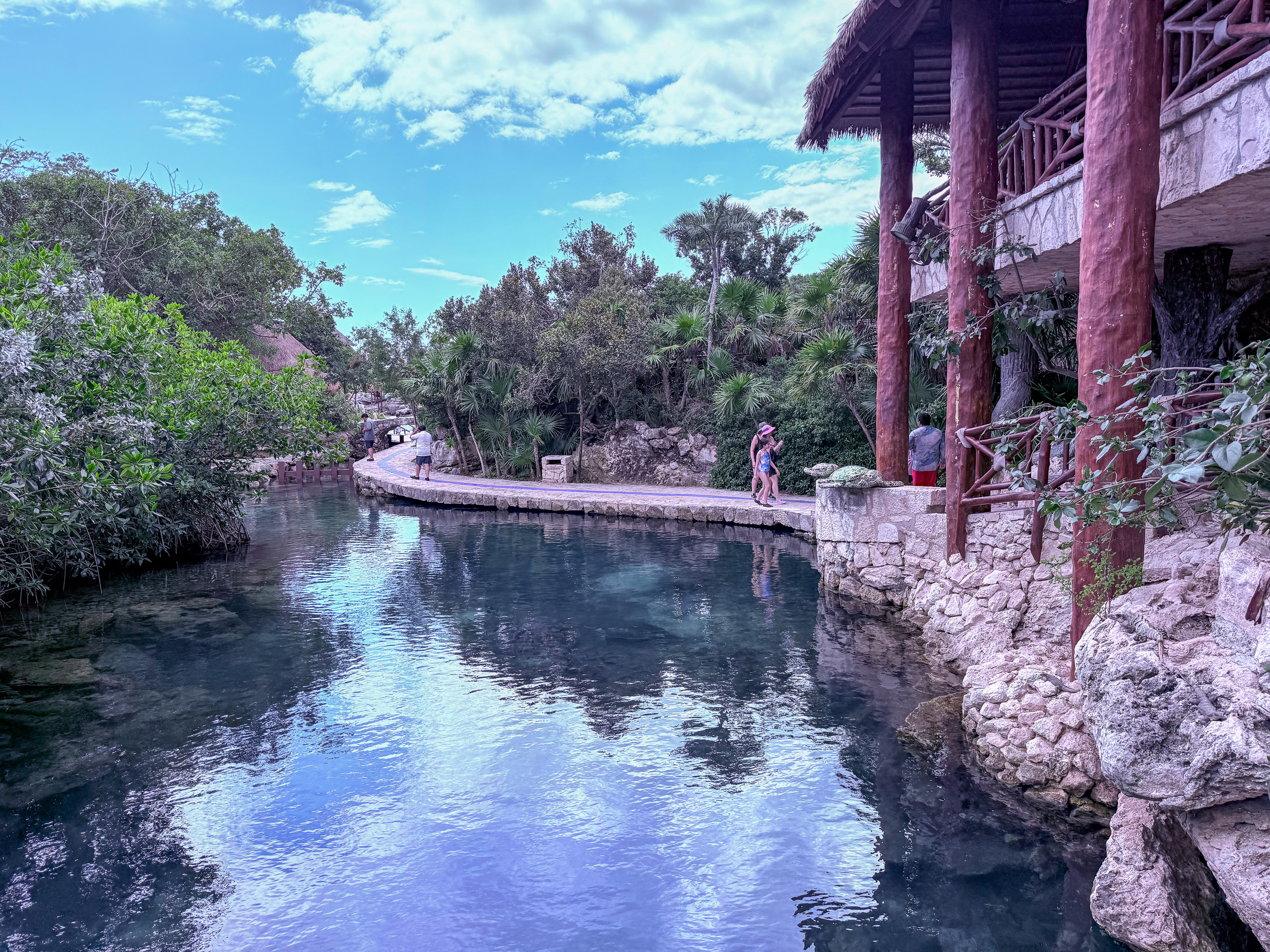 The resort's river channel running between the rock walls, the building above